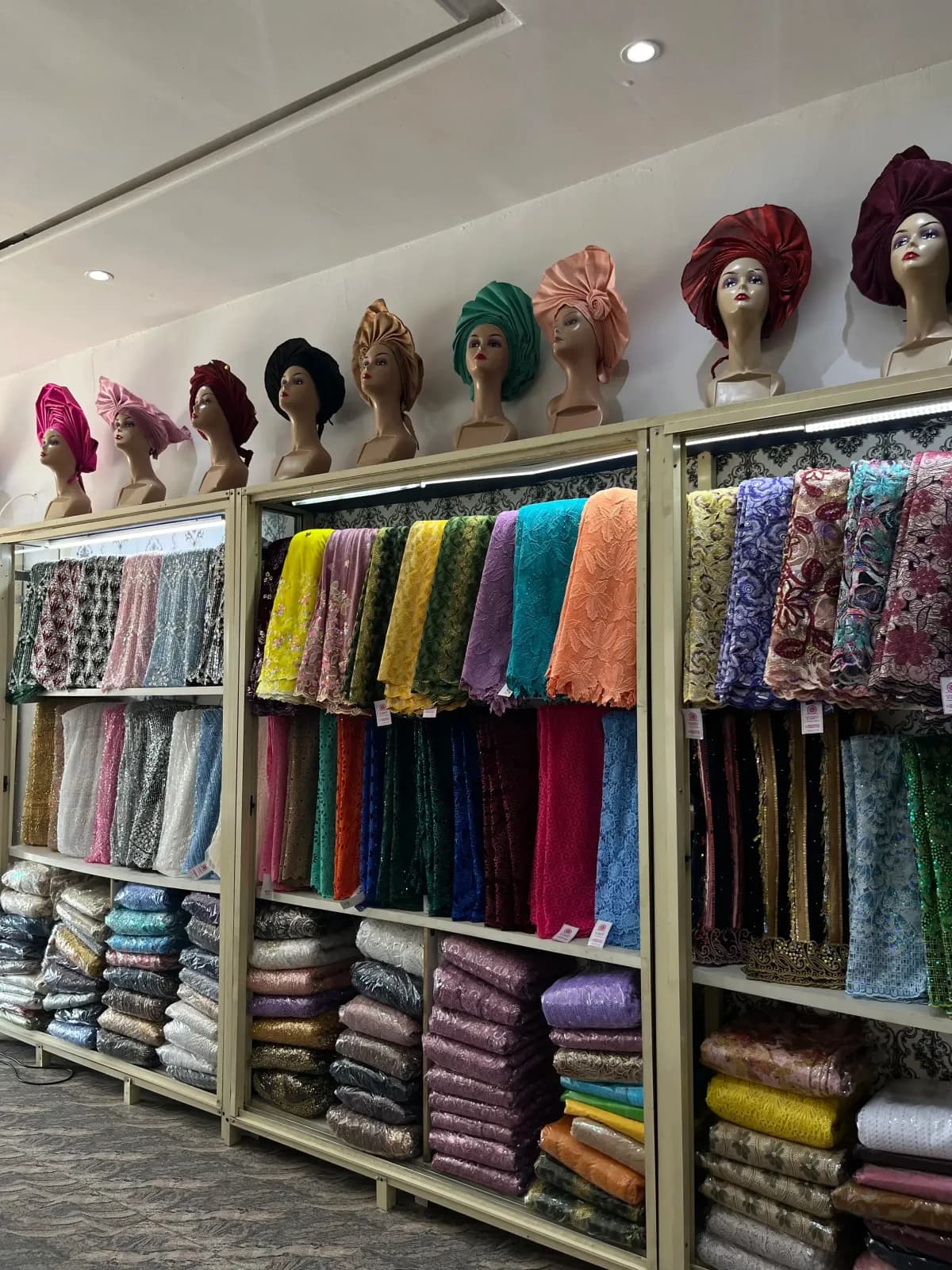 Colourful fabrics displayed inside the Goodness and Mercy Ventures store